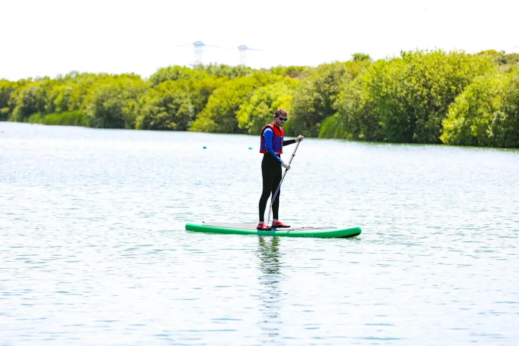 Stand up paddleboarding on a scenic UK lake