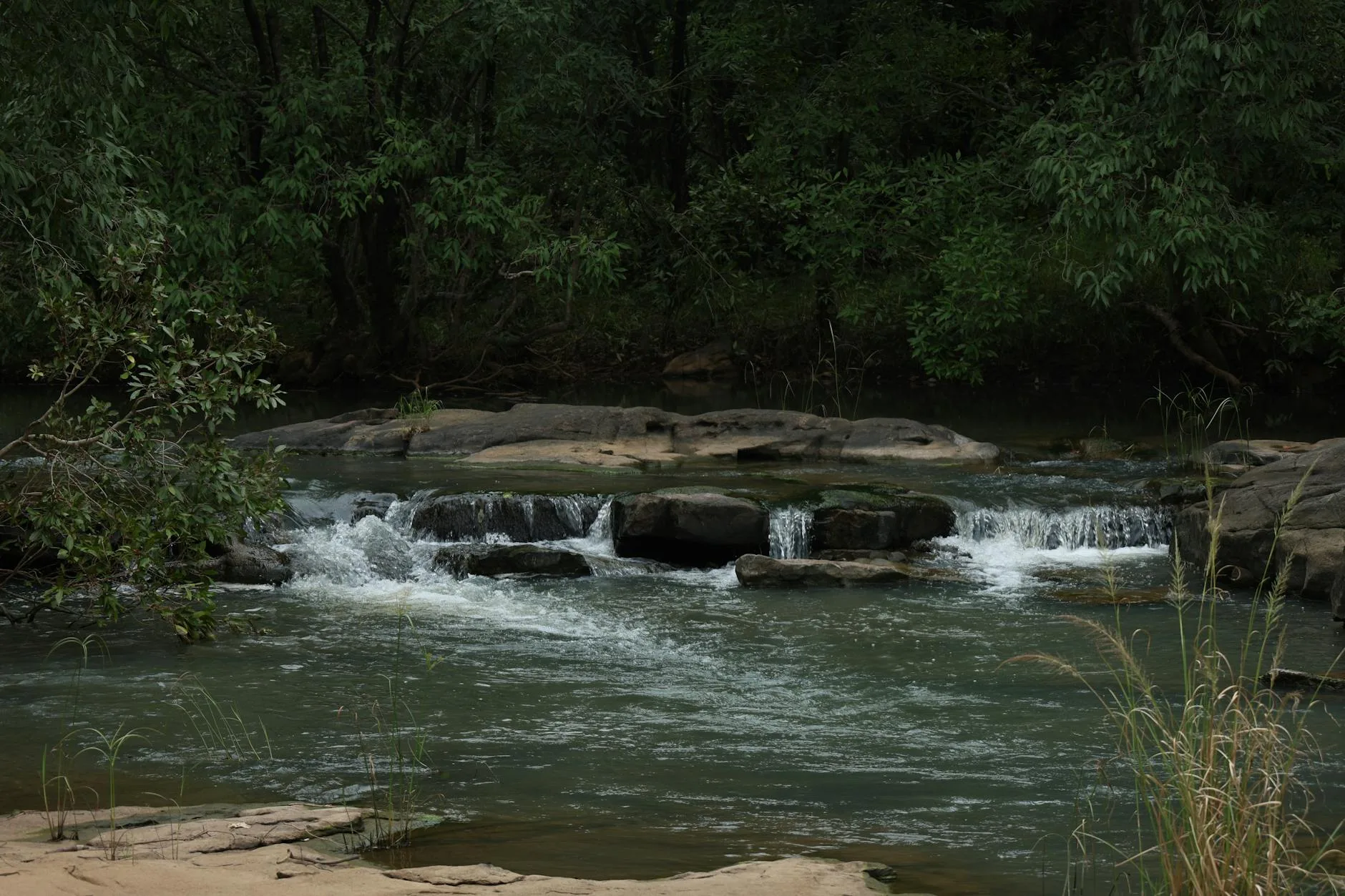 Calm river with gentle flow through peaceful scenery