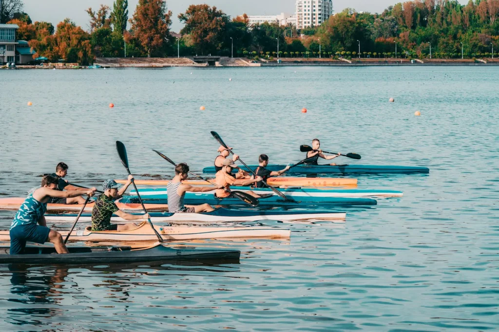 Group of kayakers paddling on a calm river