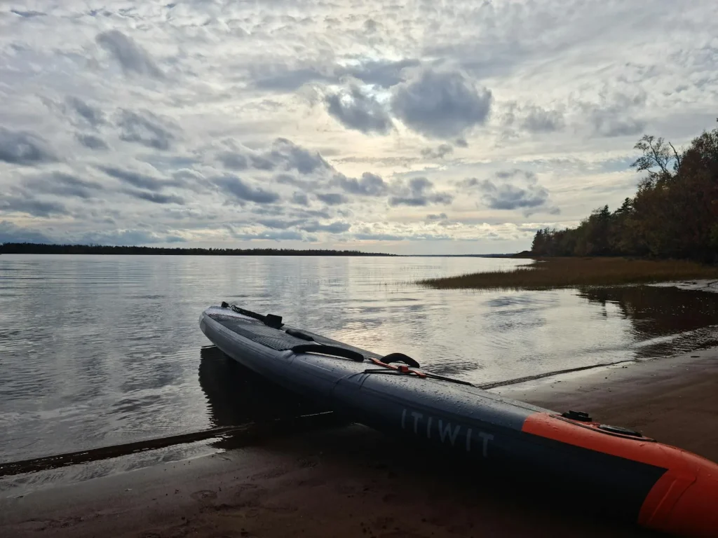 Inflatable kayak on a calm lake with paddles ready for a day out