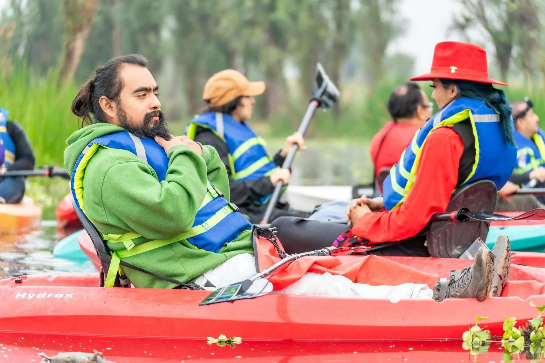 Kayaking instructor teaching a group on a lake
