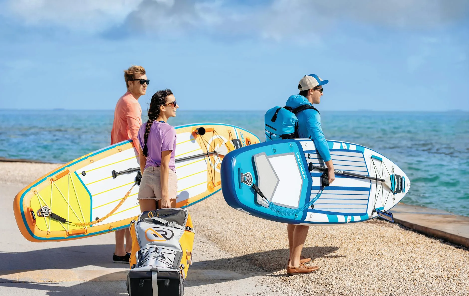 Paddleboard accessories including pump and backpack laid out