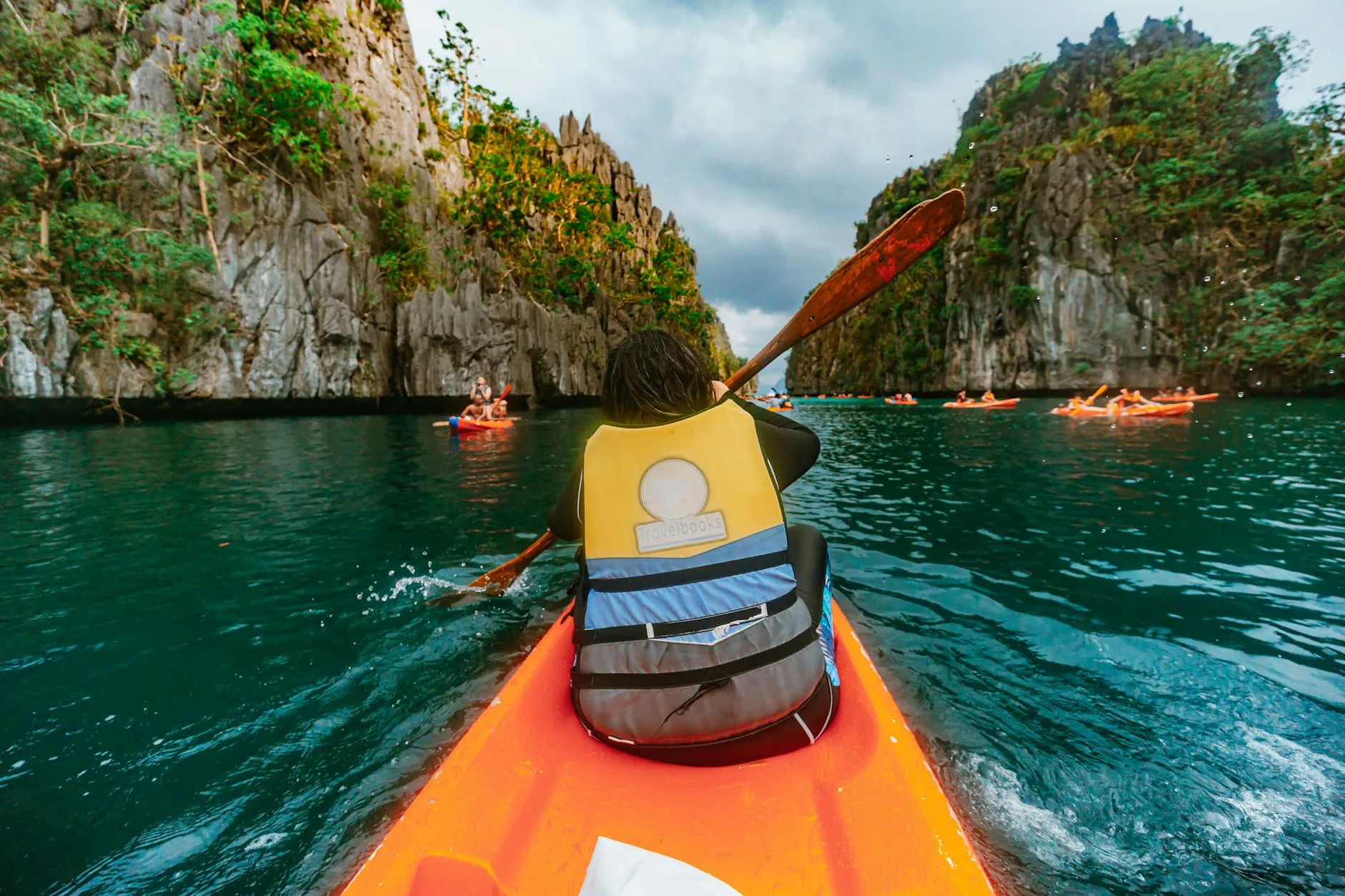 View inside a kayak cockpit showing the seat and paddle