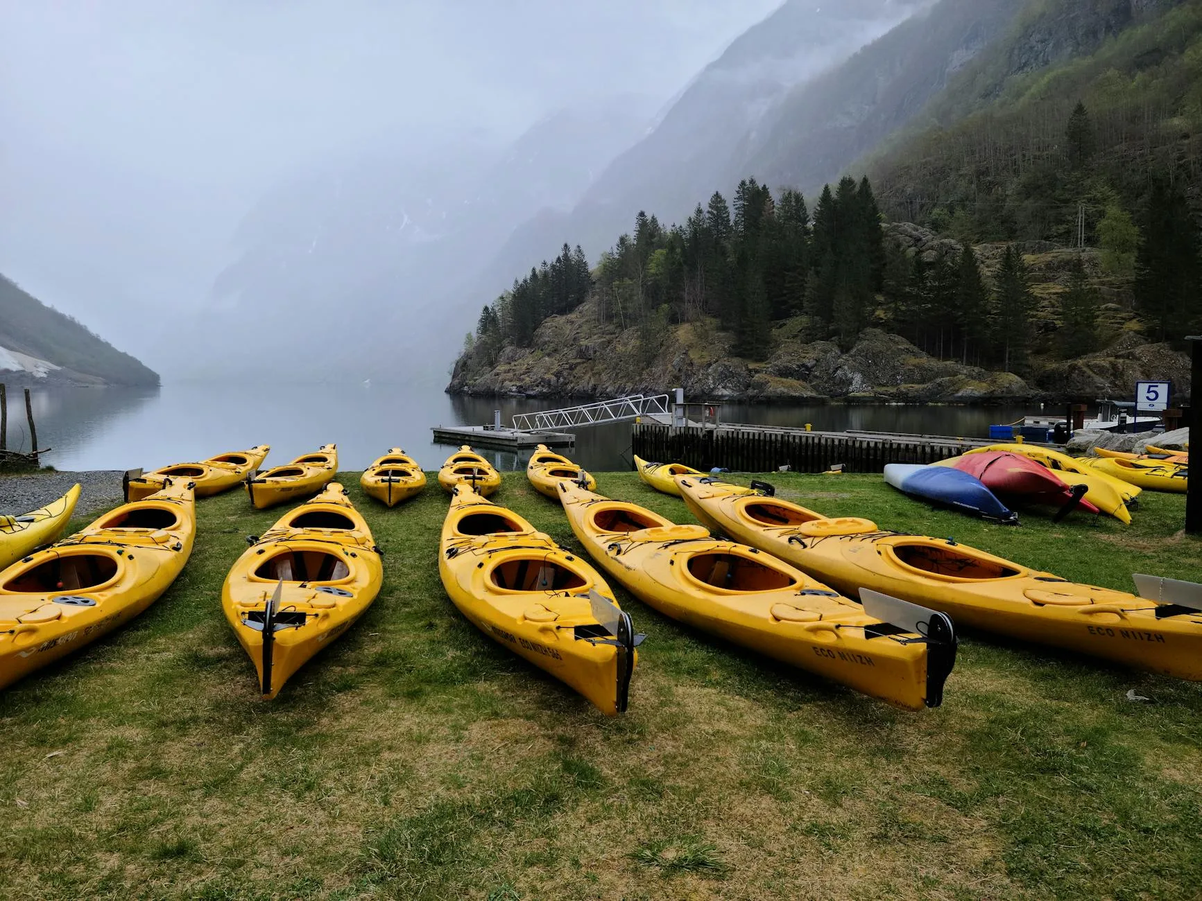 Kayak on a scenic lake with mountains in the background