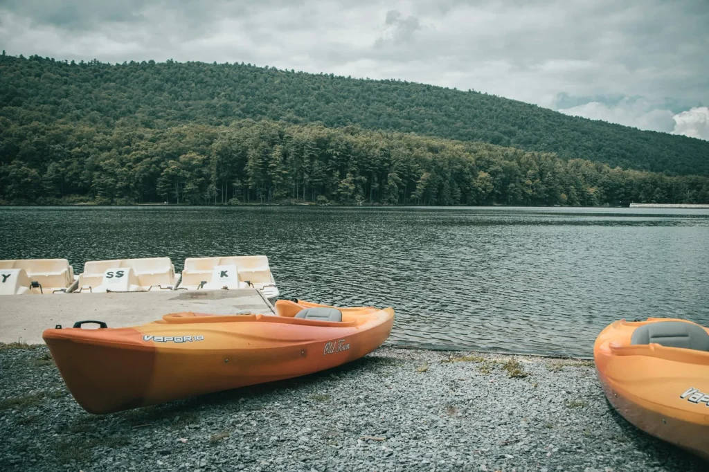 Kayak on shore ready to launch into lake