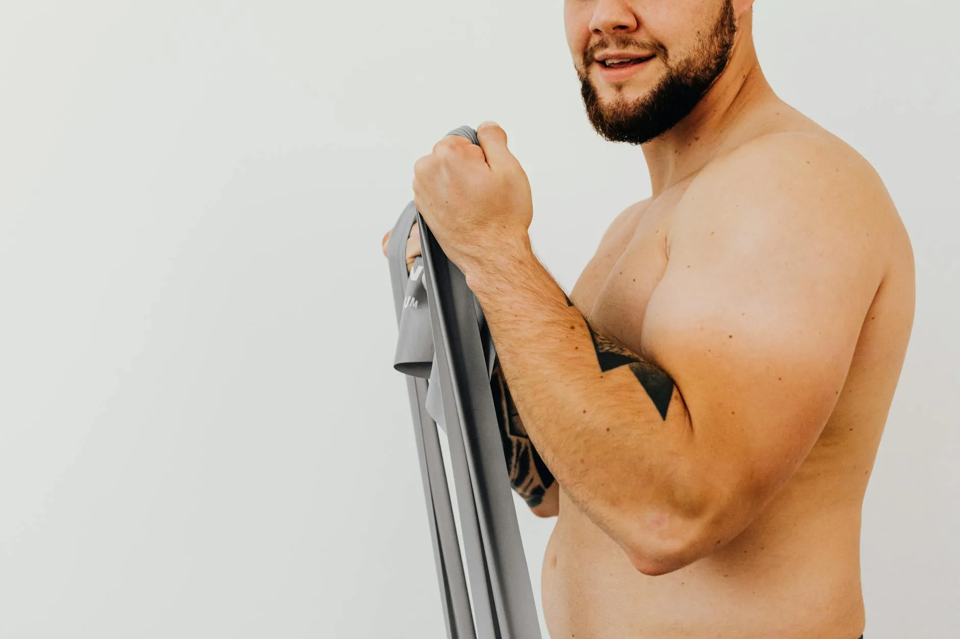 Person doing a resistance band shoulder exercise at home