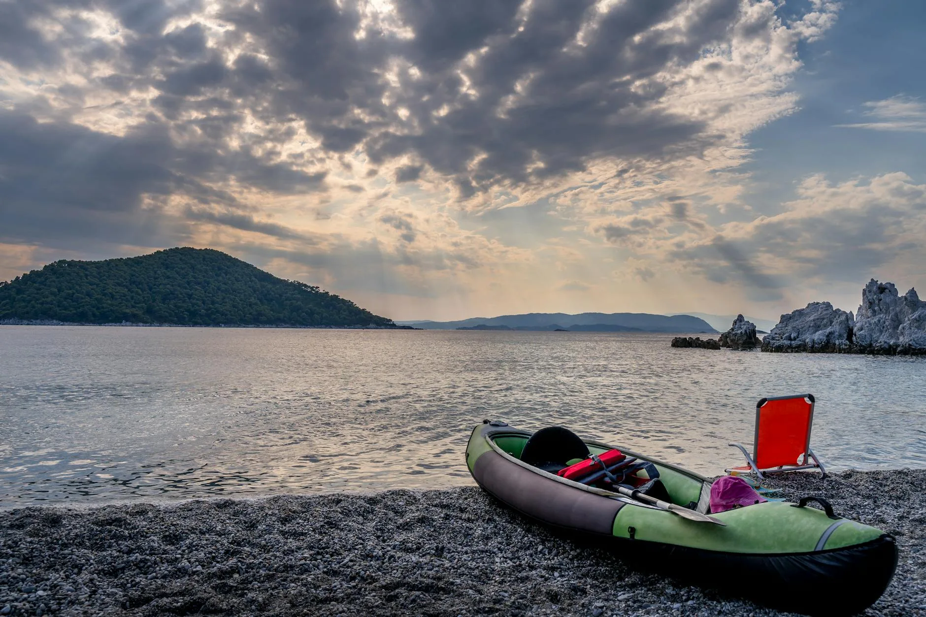 Dry bag and paddle kit on the shore after kayaking