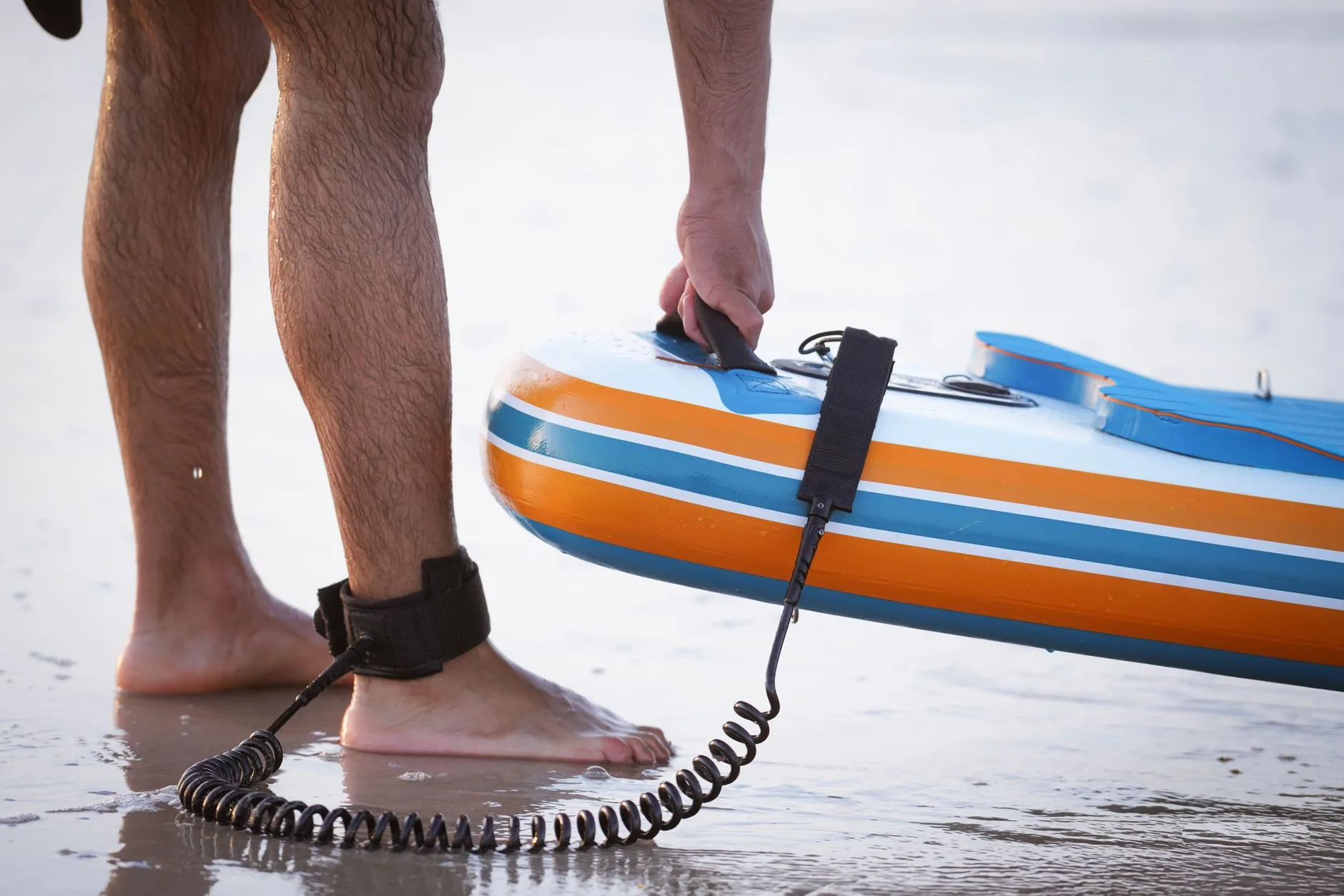 Paddleboard ready on a beach for sea paddling safety checks