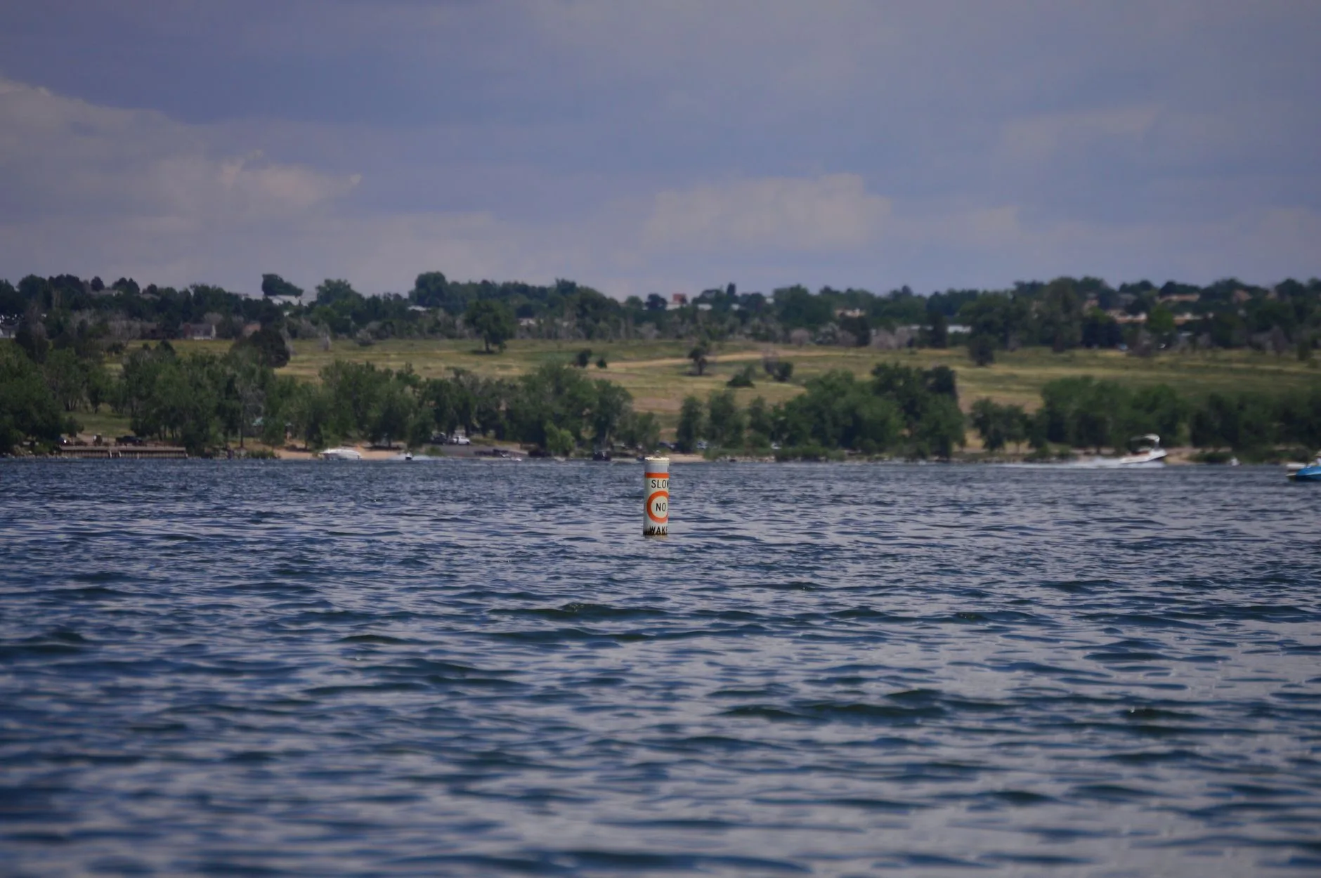 Paddleboarder practising a buoy turn on flat water