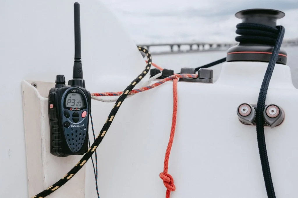 Handheld VHF radio for paddlers beside a kayak