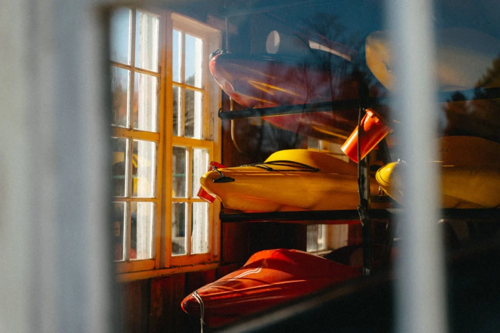 Kayak stored on a garage wall rack at home