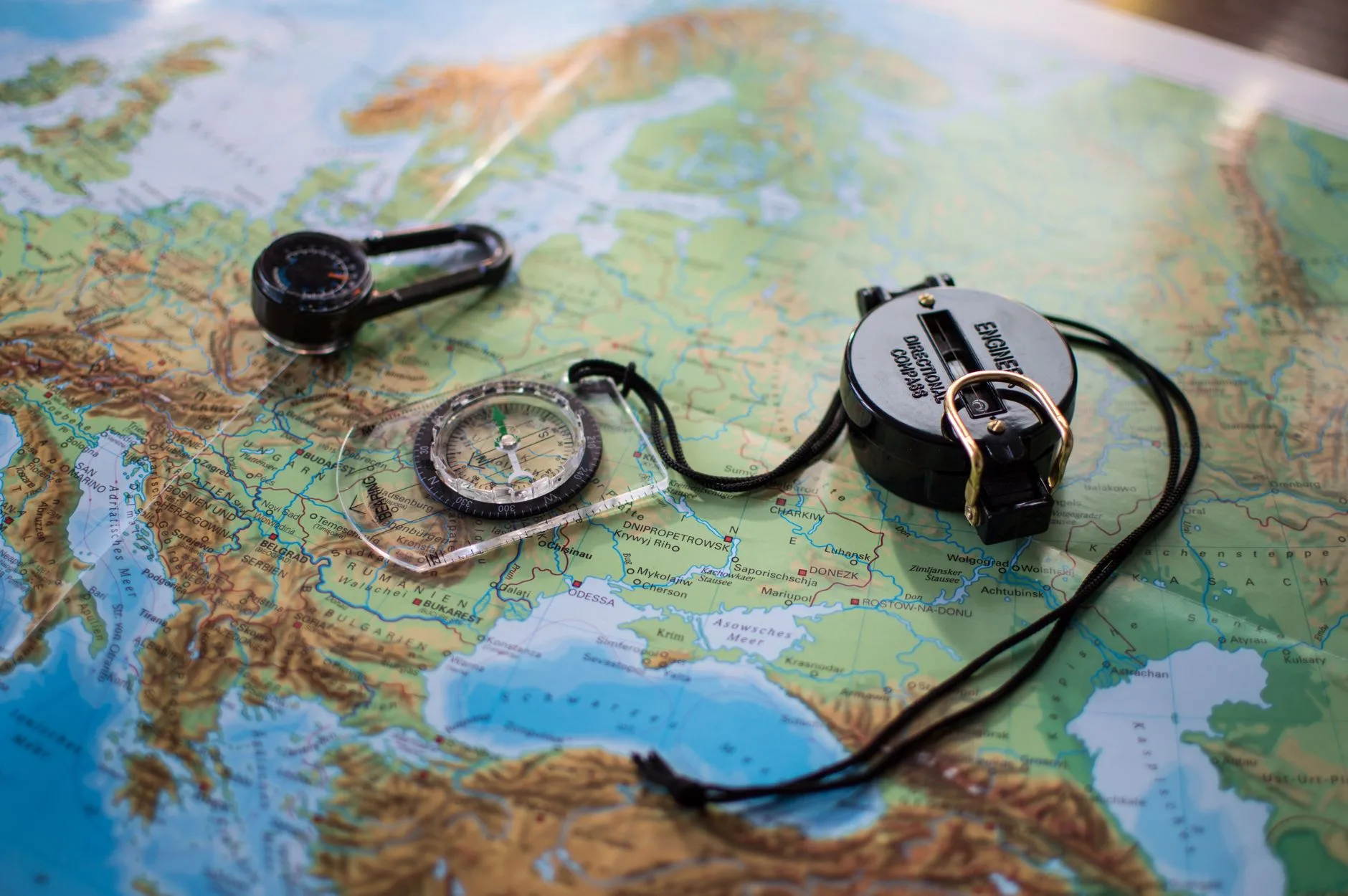 Map and compass used for planning a coastal kayak route