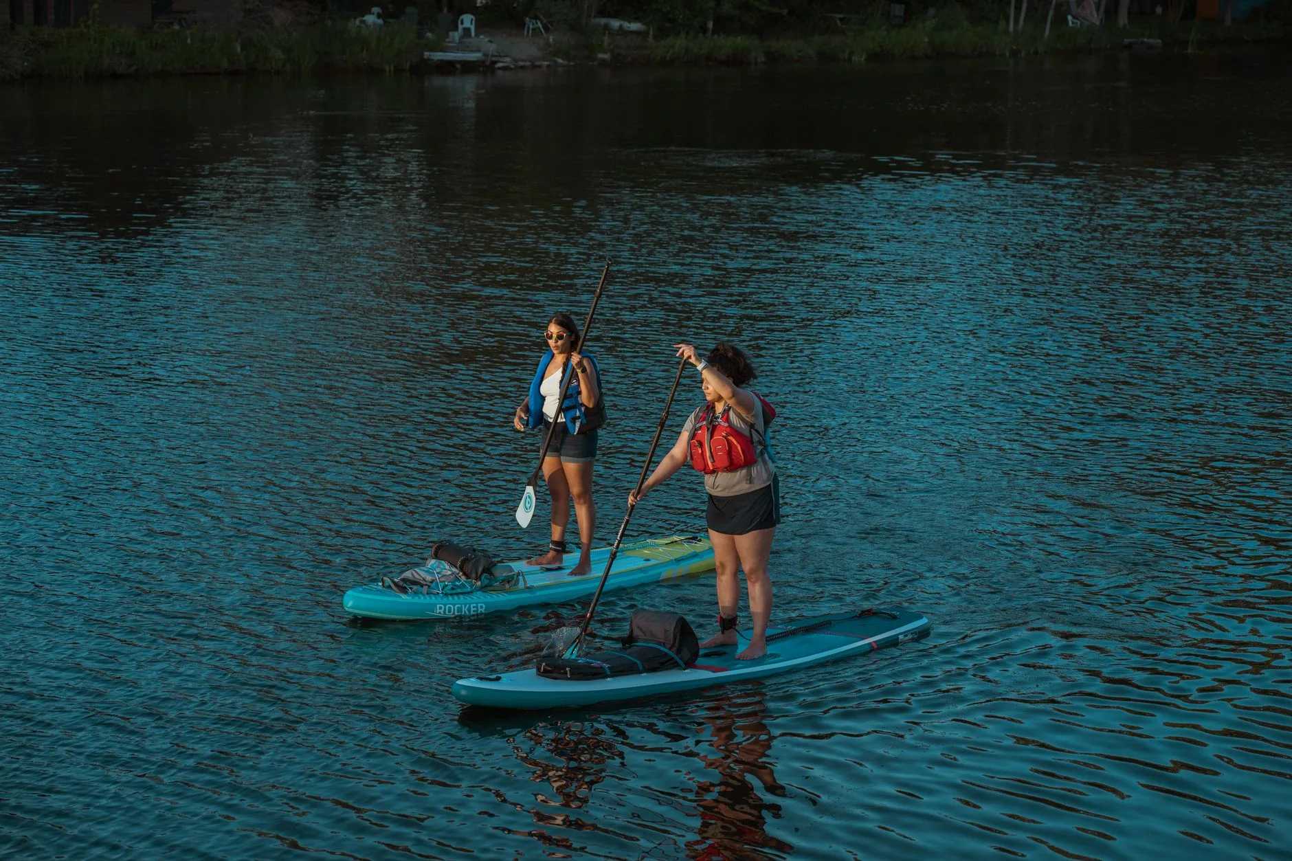 Touring SUP board with dry bag storage for longer paddles